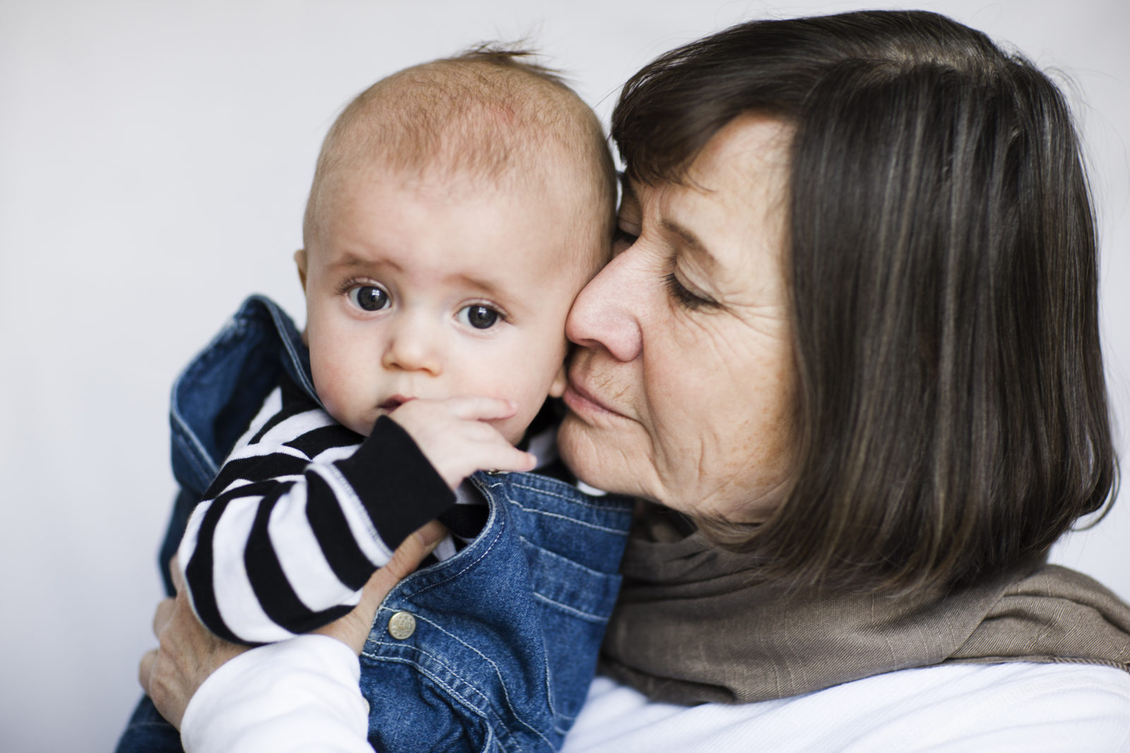 Older woman holding her grandchild