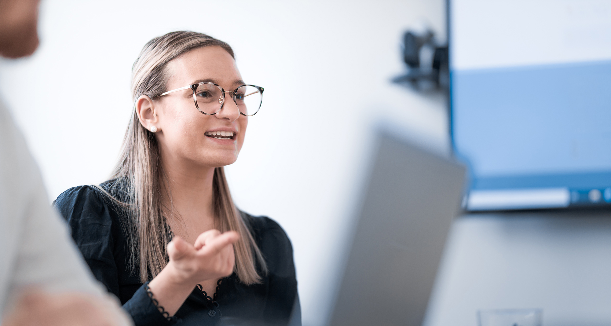 Sectra colleague engaged in meeting