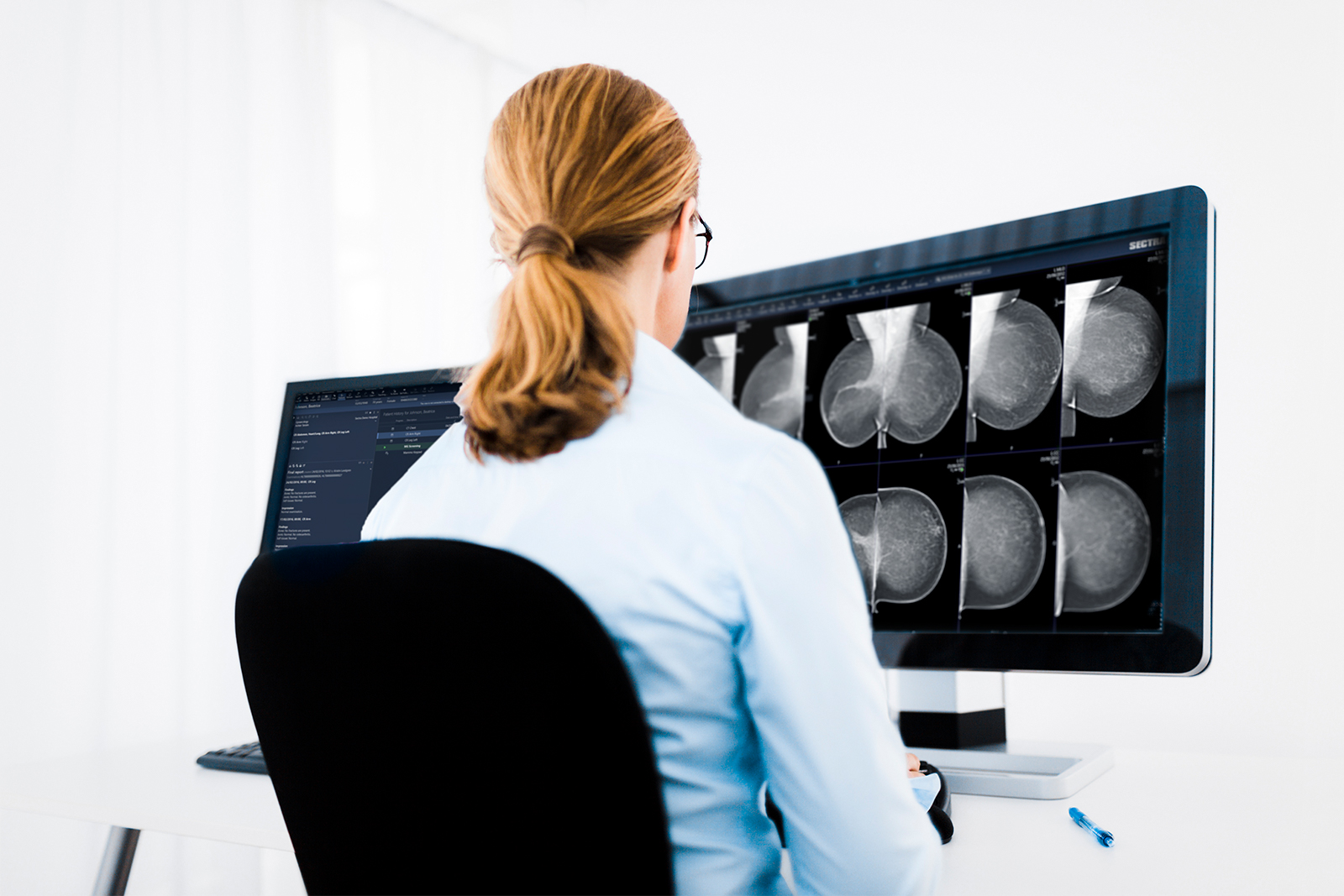 Female radiologist reading breast images on Sectra Breast Imaging PACS (new GUI)