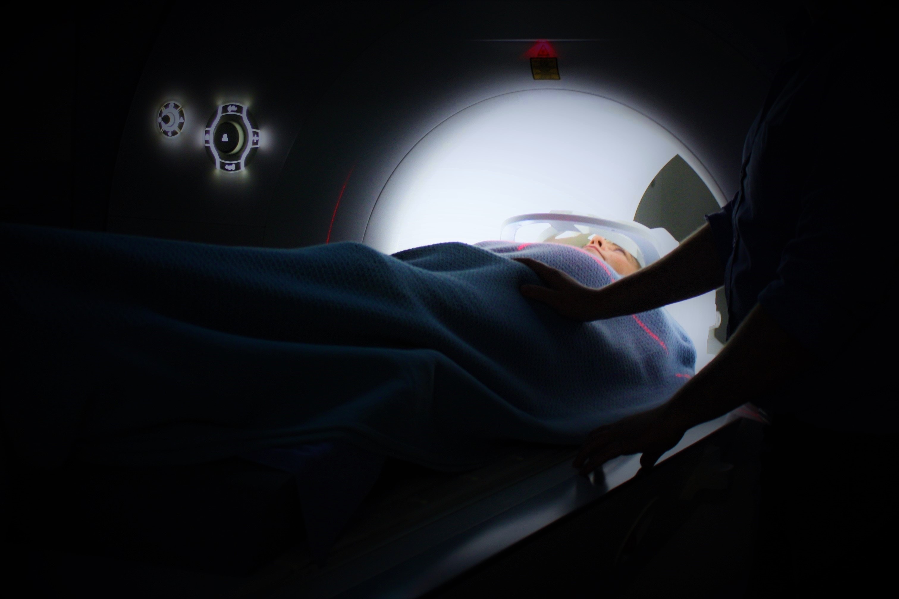 Person lying on CT scan machine